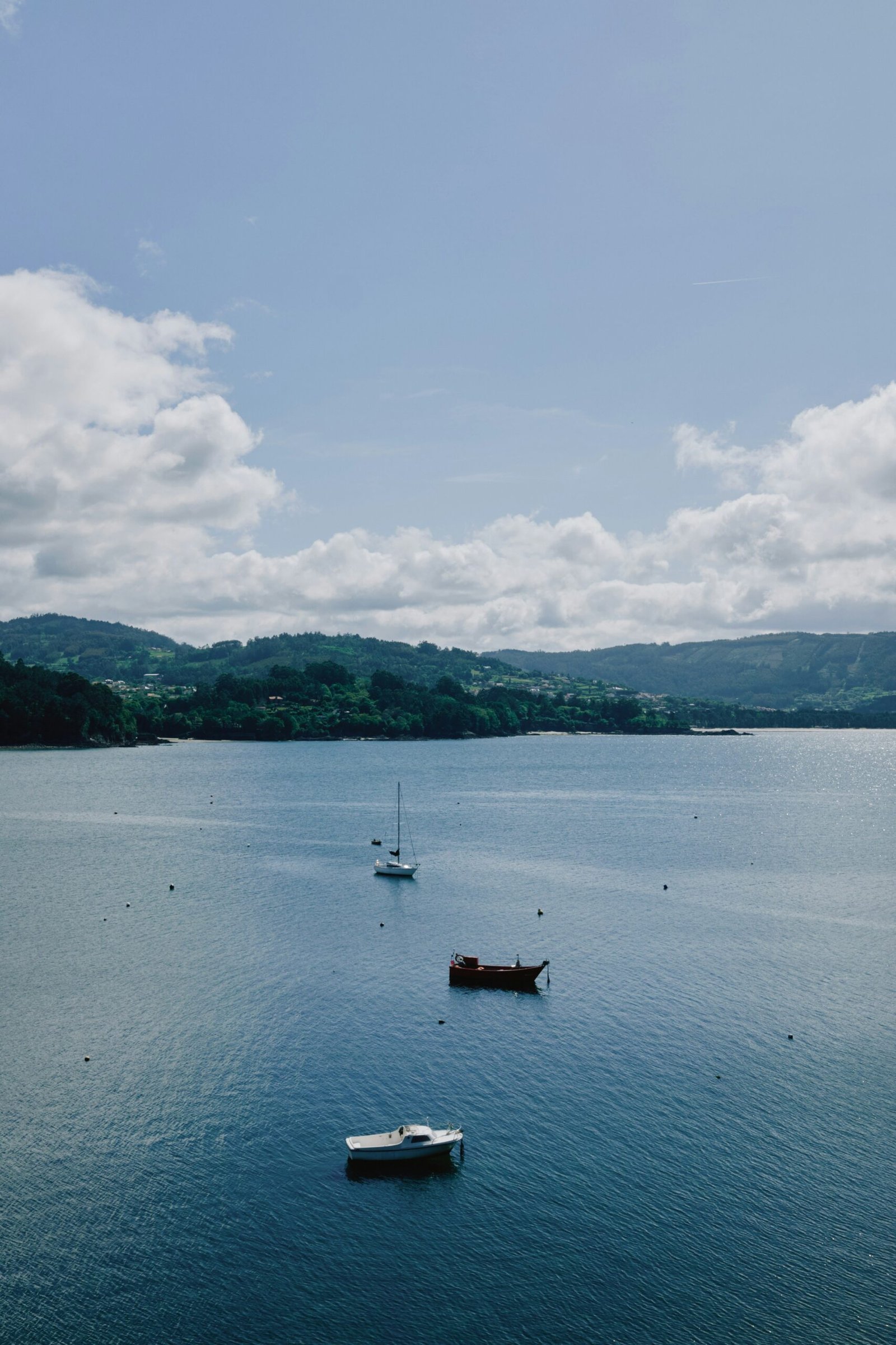 a body of water with boats floating on top of it